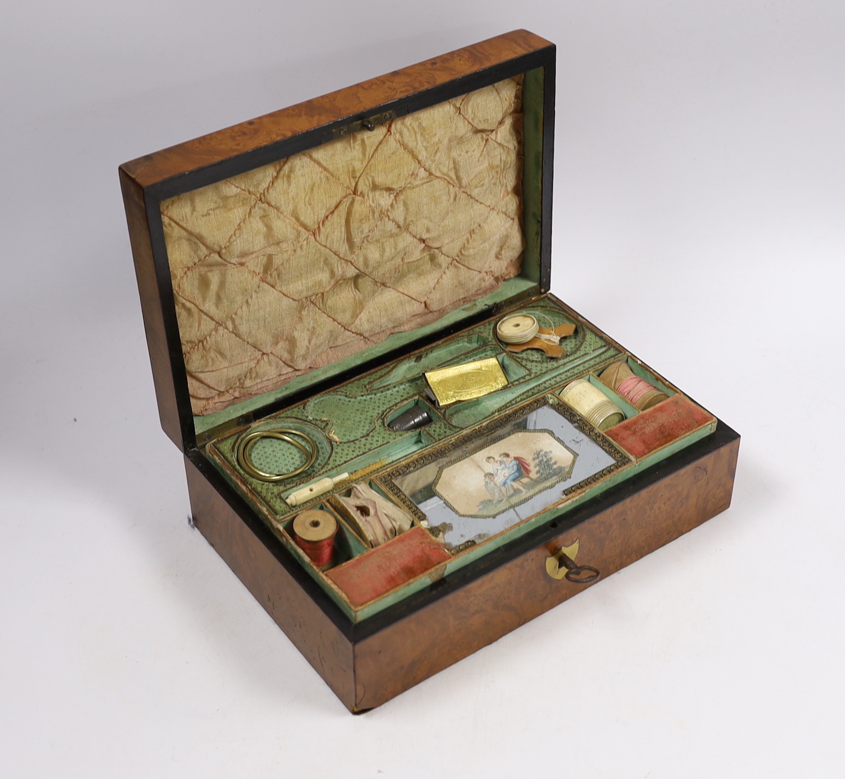 An early 19th century French bird's-eye maple and a walnut sewing box containing some sewing accessories, 24 x 16 x 8cm